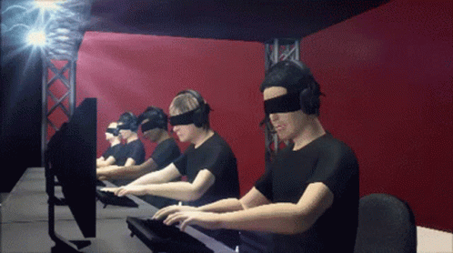 three men in virtual reality headset working on a computer