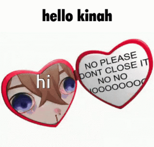 a heart shaped brooch sitting next to a sign saying hello kinah