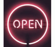 a neon sign with the word open