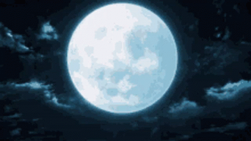 a large, bright moon in the sky with clouds