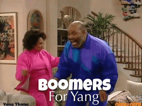 two people stand near each other with the words boomers for yangg on the side