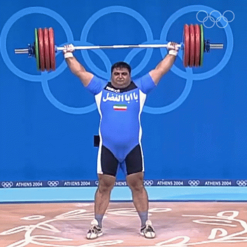 a man doing a weight lifting exercise in an olympics event