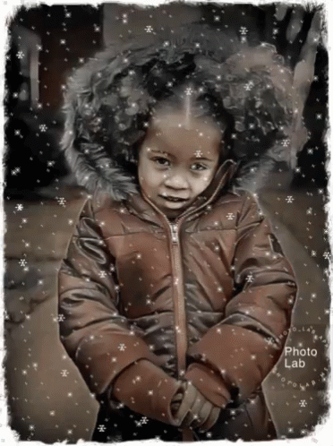 a little girl in a winter coat that looks like a doll