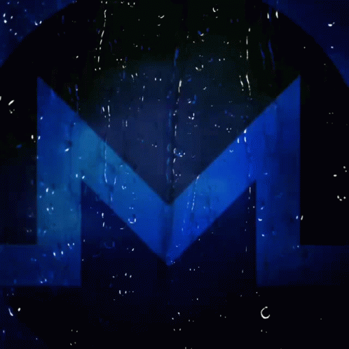 a multi - colored image of the letter m, with water drops around