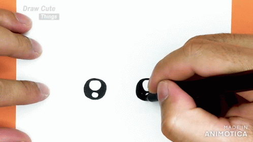 two hands are writing on an open notepad with small black object