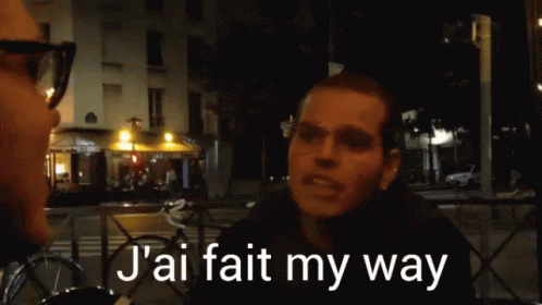 a man standing outside at night with words reading'aj fatal my way '
