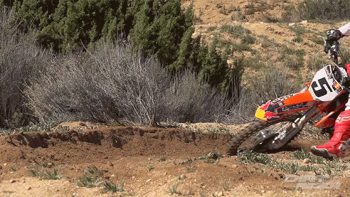 a man on a dirt bike in the dirt