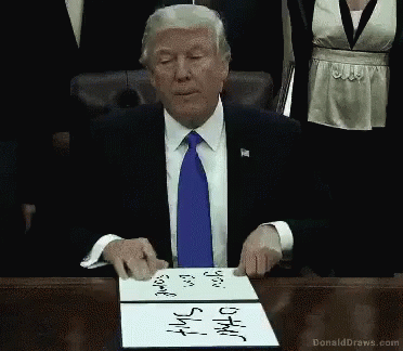the chinese president is holding a piece of paper with writing on it