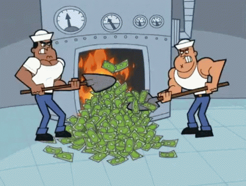 two blue men holding money in front of a fireplace