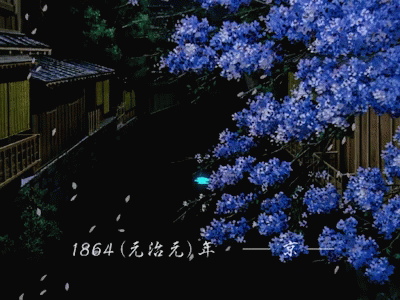 a street at night with a tree in bloom