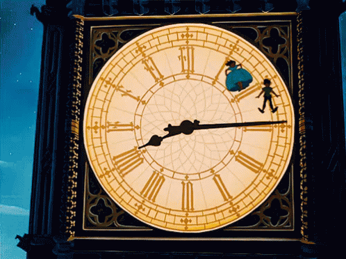 a close up of a big clock with roman numerals