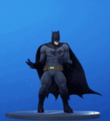 a batman statue on a platform that looks like it has just come out of the box