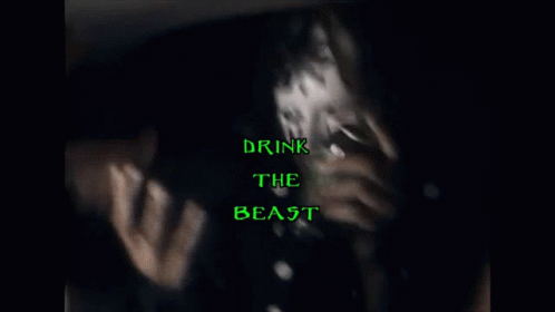 a blurry po of the word drink the beast