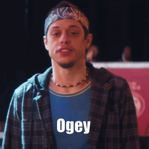 a man wearing a hat with the word ogey written on it
