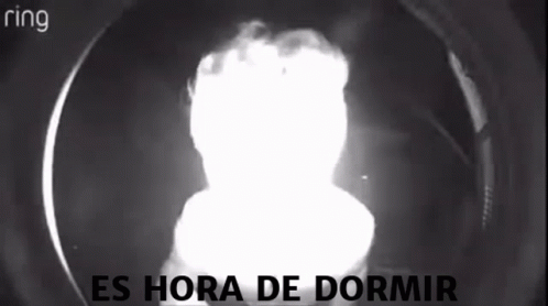a light shining in a glass dome that says es hora de dormir