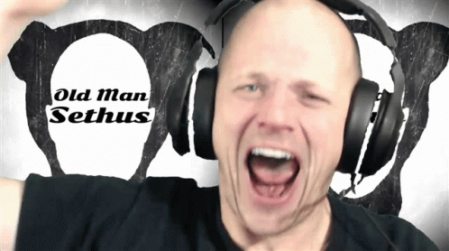a man wearing headphones is shouting into the air