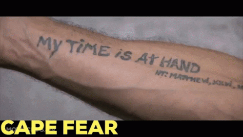 a person is holding up their arm with the text my time is at hand on it
