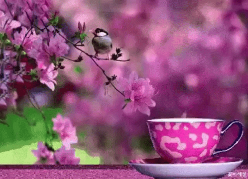 a pretty picture with a purple cup and saucer