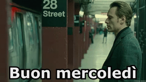 a man in suit and tie on subway platform with words saying bacon mercolidi