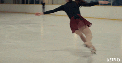 an image of a woman performing on ice skating