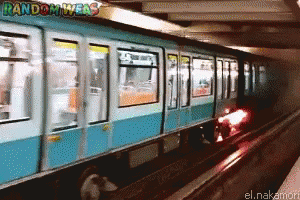 a blurry image of a train traveling through the subway