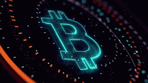 a yellow bitcoin symbol projected on top of a dark background