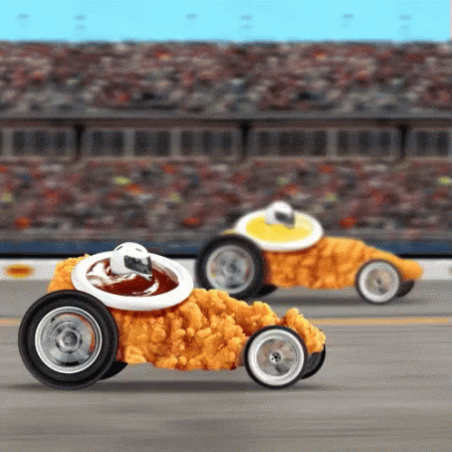 an image of two blue cars racing on asphalt