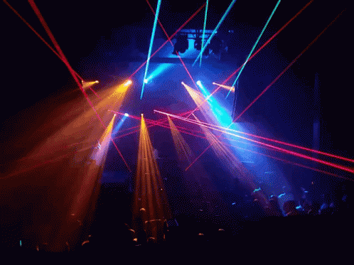 light beams show from different angles to illuminate the concert