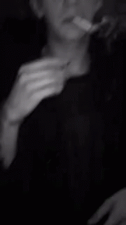 an image of a person smoking a cigarette