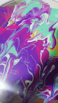 colorful pattern of liquid pouring out of a water dish