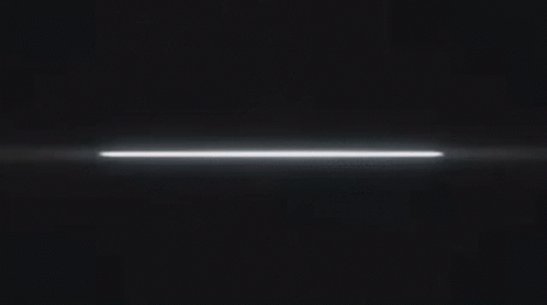 a thin glowing light streaks across a black background