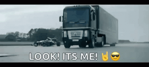 a large semi truck driving down a road