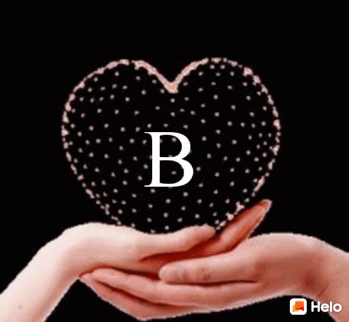 hand with letter holding a heart shape