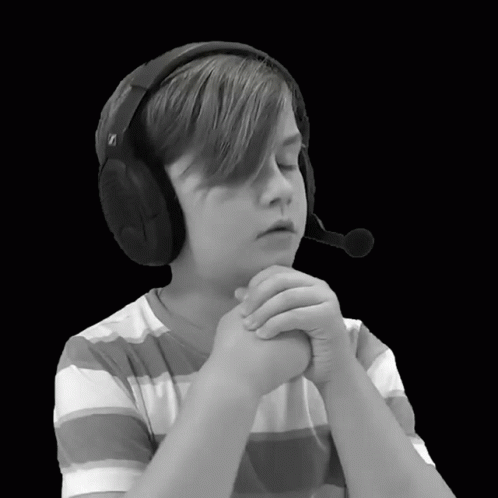 a boy in headphones is looking to the side