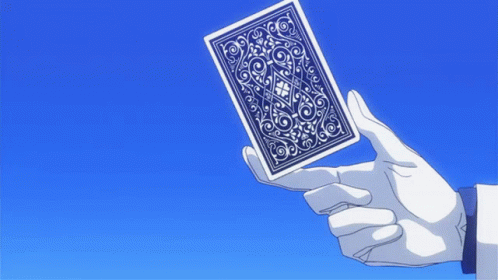 the hand is holding an object that appears to be a playing card