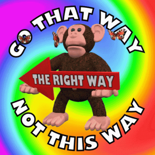 a monkey holding a sign in front of a rainbow colored background