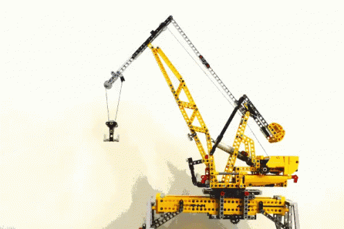 a construction crane holding a camera above a body of water