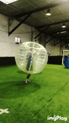 a person in an inflatable ball being filmed