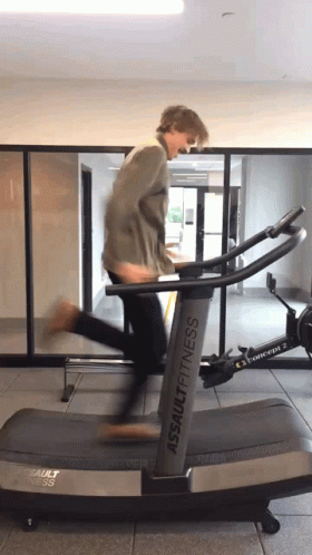 a man runs on a treadmill as he moves