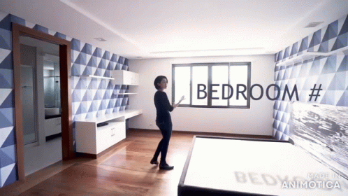 this is an image of a bedroom with a bed