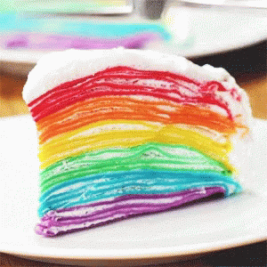 there is a cake with multi - colored frosting