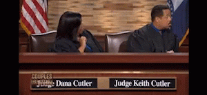 a screen s of judge kelth center with the president sitting behind