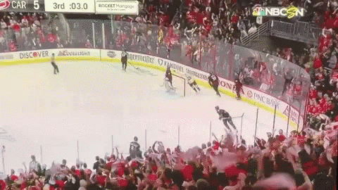 an ice hockey game in the middle of a stadium