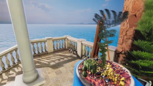 a balcony with an exotic view and flowers on the tables