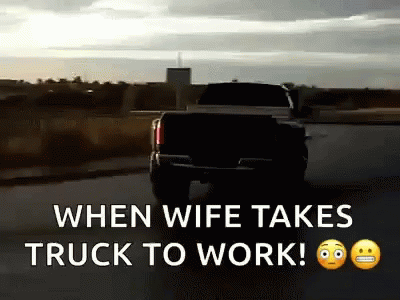 a truck going down the road with a message saying when wife takes truck to work