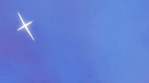 an airplane in the sky with a bright white light above