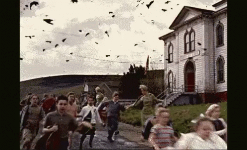 a picture with people in front of a house and bats flying