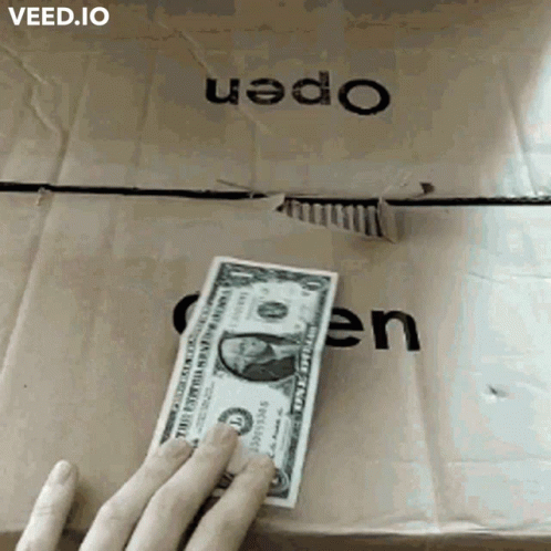 a hand reaches to get a dollar bill out of a box