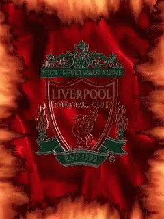 a blue tie dye background with the liverpool emblem