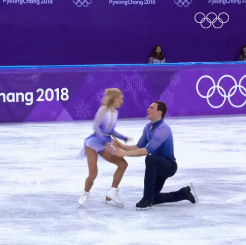two figures performing in an ice skating competition